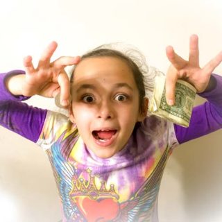 Girl is holding money she earned