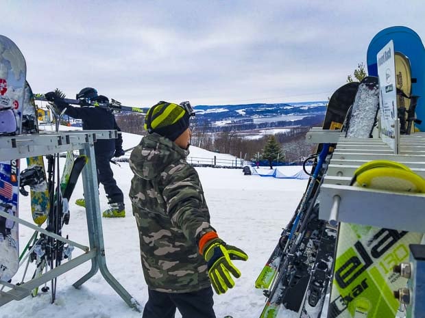 Ski at the Chestnut Mountain Resort standing on top of hill