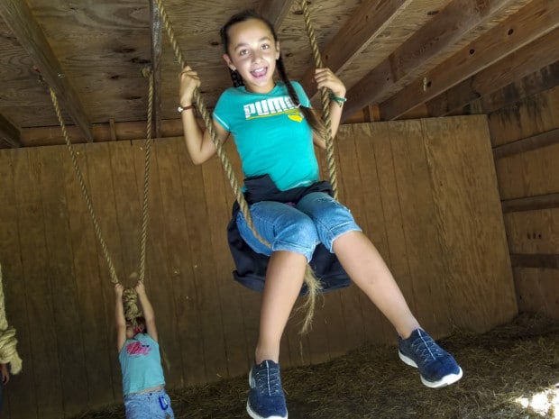 girl on swing at Apple Works