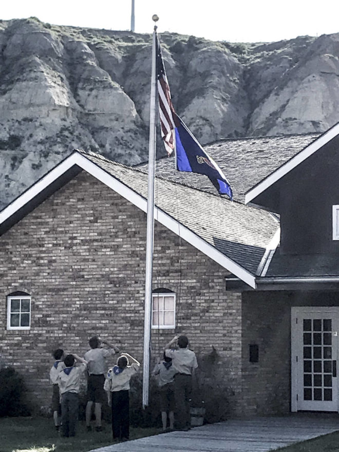 Scout troop is raising the flag in Medora North Dakota