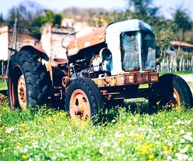 Tractor Museums - ancient tractor on green lawn