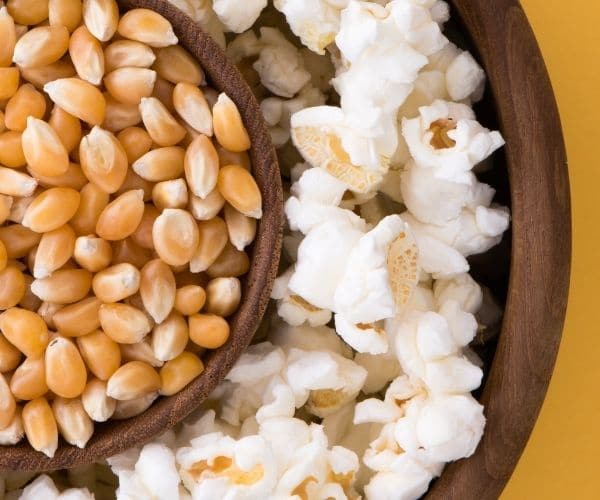 Popped and whole corn kernels