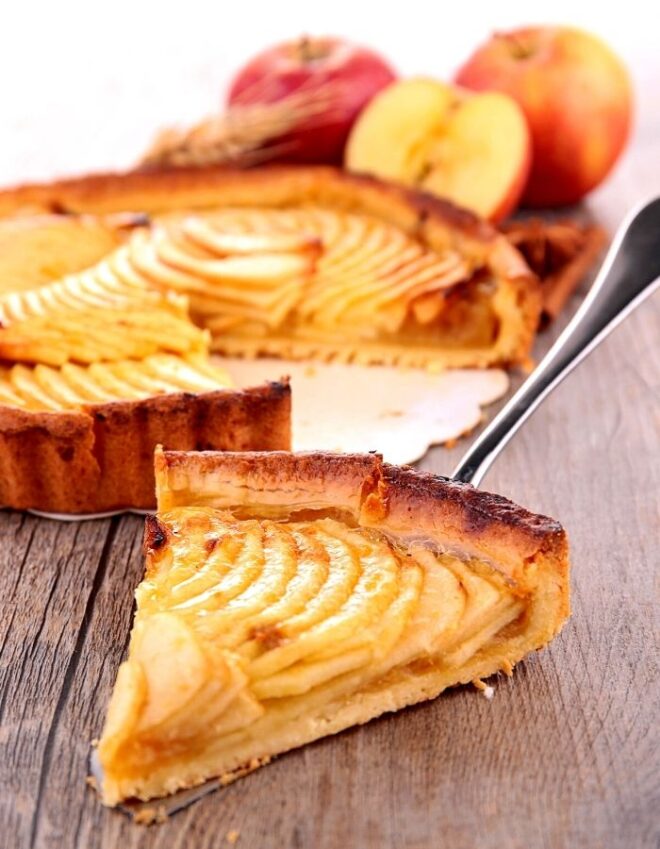 A slice of apple pie on service spoon